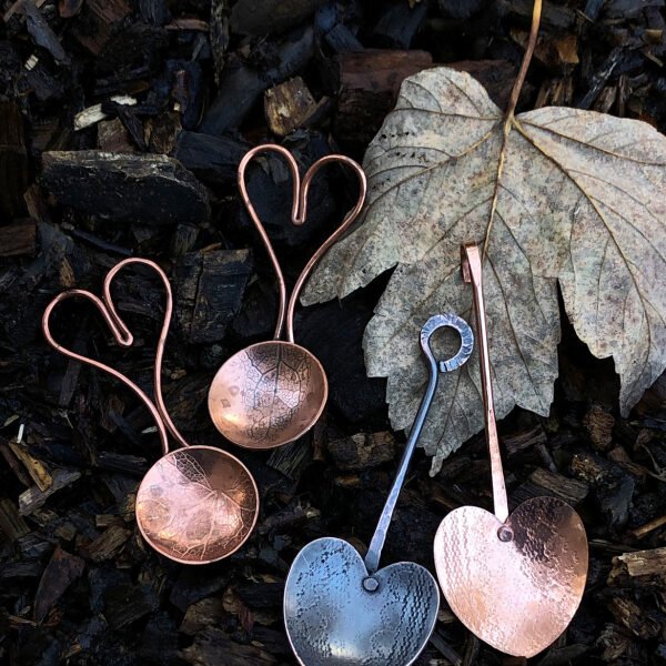 Copper and oxidised copper spoons