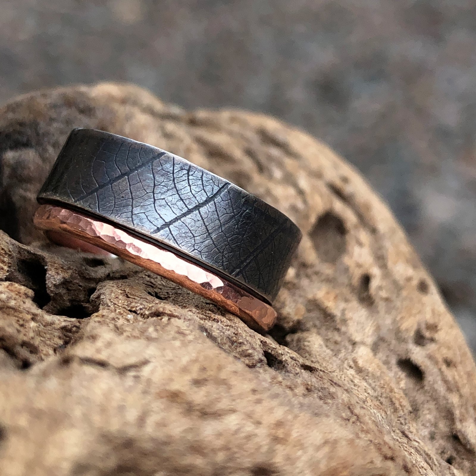 Oxidised silver ring with leaf print and hammered copper ring