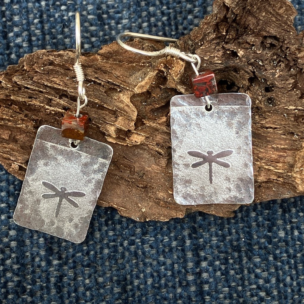 Silver earrings with dragonfly print and brown bead