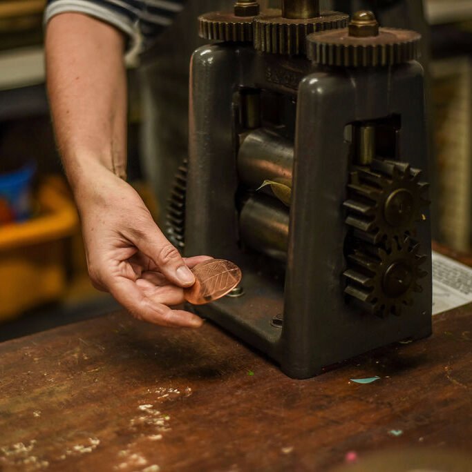 Roll printing a leaf onto copper