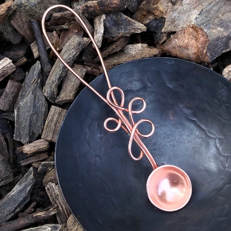 Copper spoon and oxidised copper bowl