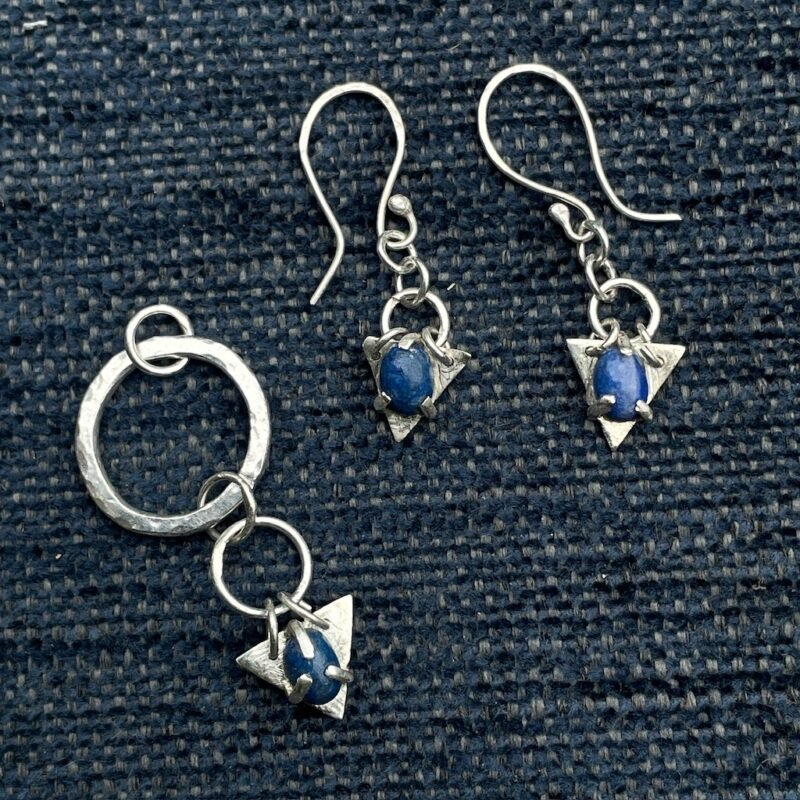 Silver and blue gemstone earrings and pendant