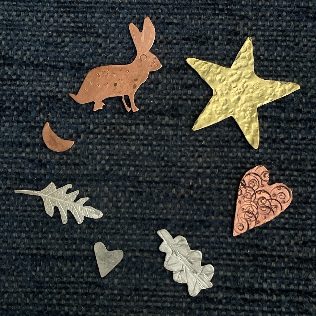 Silver, copper and brass shapes inspired by nature