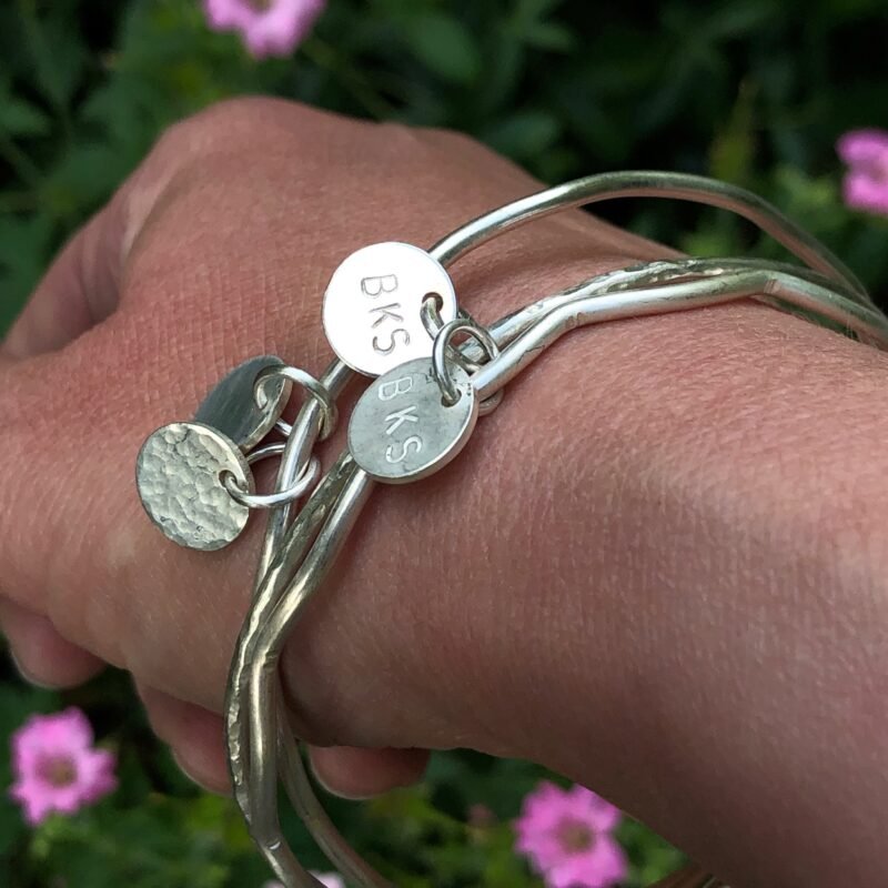 Silver charm bangles with ID tag charm