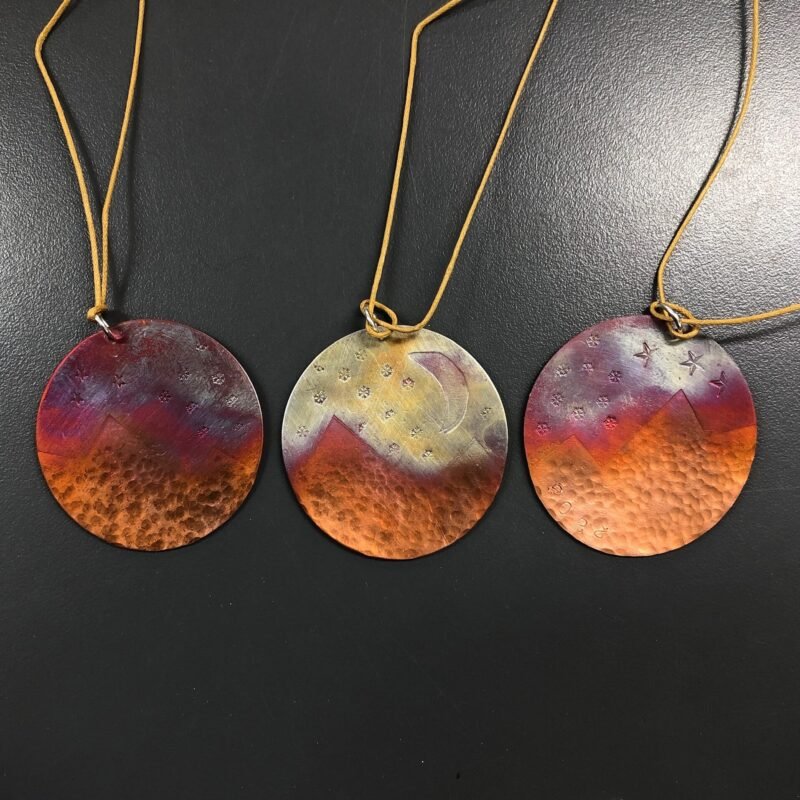 Colourful copper decorations with mountains