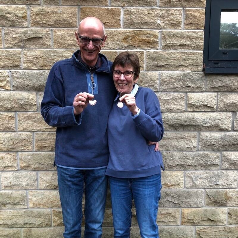 Happy couple with their love spoons