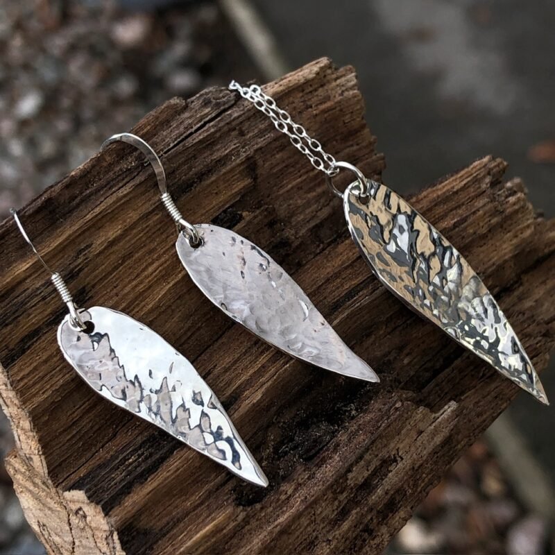 Silver pendant and earrings with hammered texture