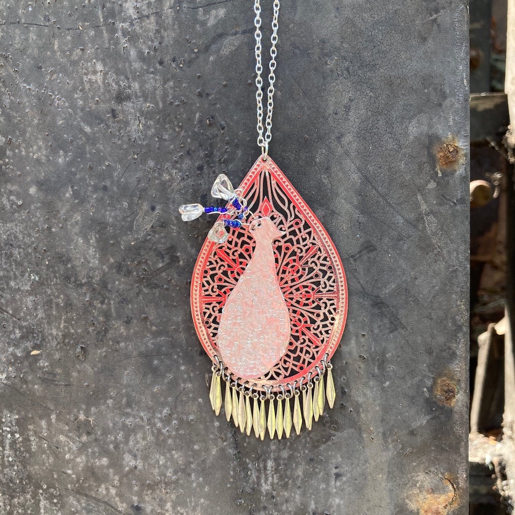Pendant with bird and beads